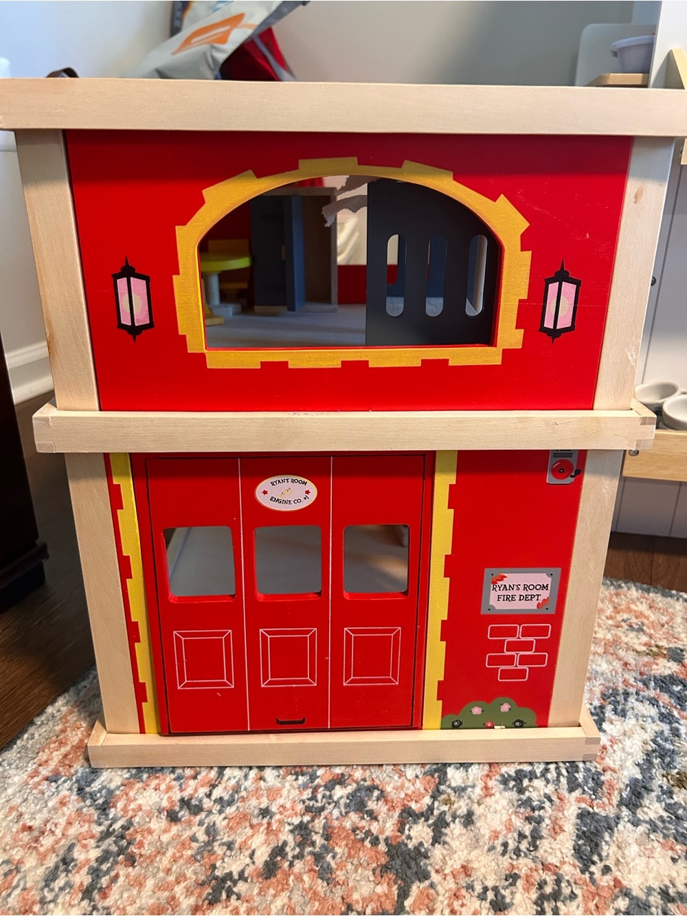 Ryan’s Room wooden firehouse by Small World Toys